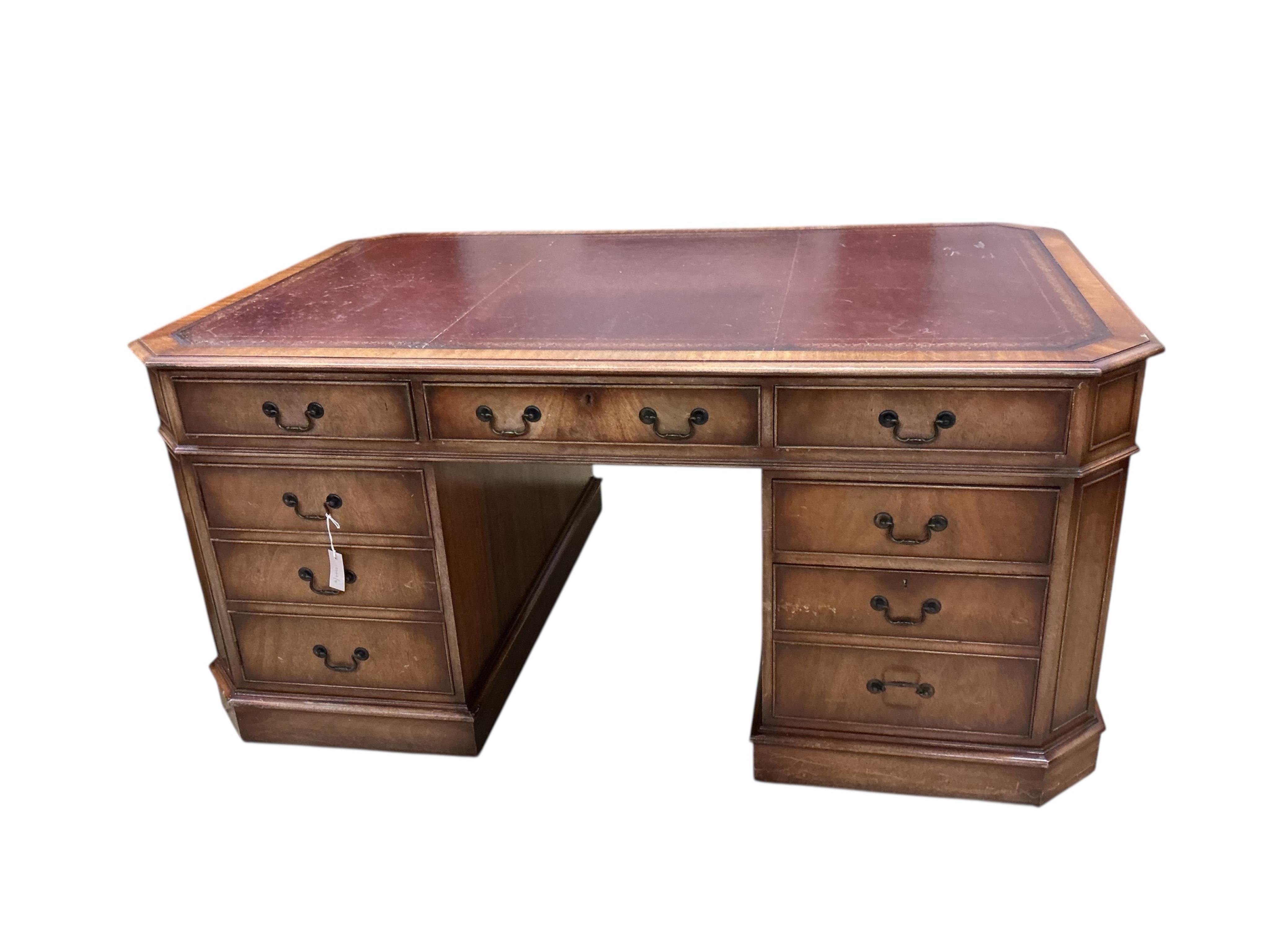 A reproduction George III style mahogany pedestal partners desk, width 166cm, depth 106cm, height 77cm